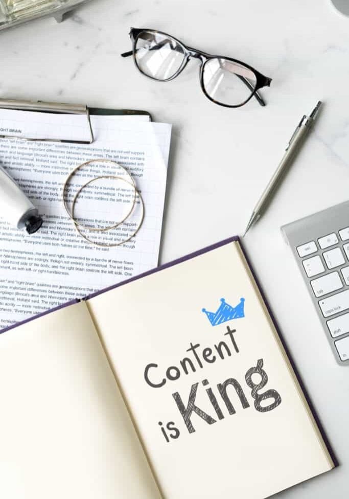 Content is king written on a notebook