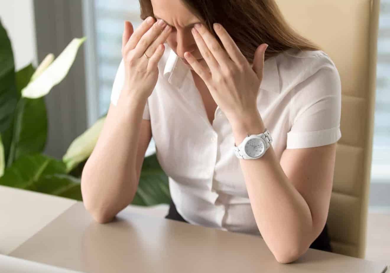 Lady with Marketing Paralysis sitting at desk in office